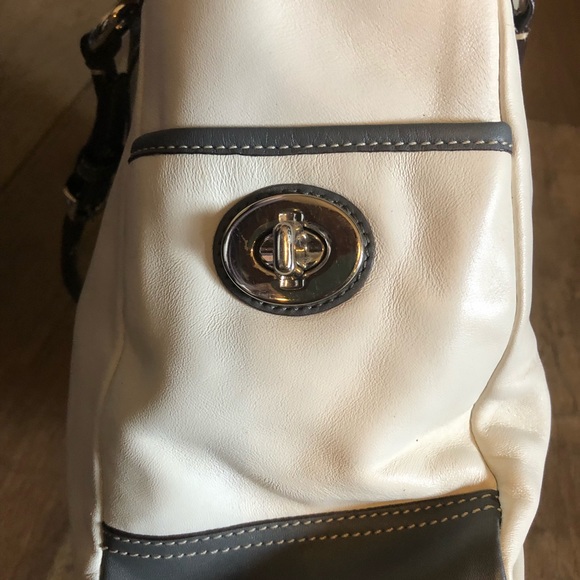 silver coach purse with purple lining